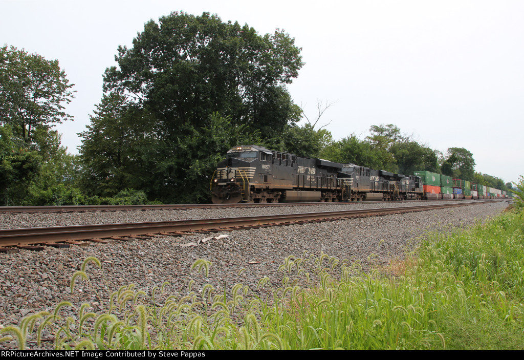 NS 8057 takes a westbound stack train past MP116